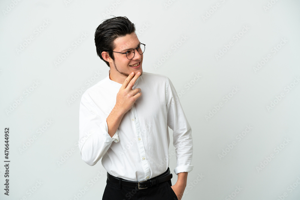 Russian Business man isolated on white background looking up while smiling Russian Business man isolated on white background looking up while smiling
