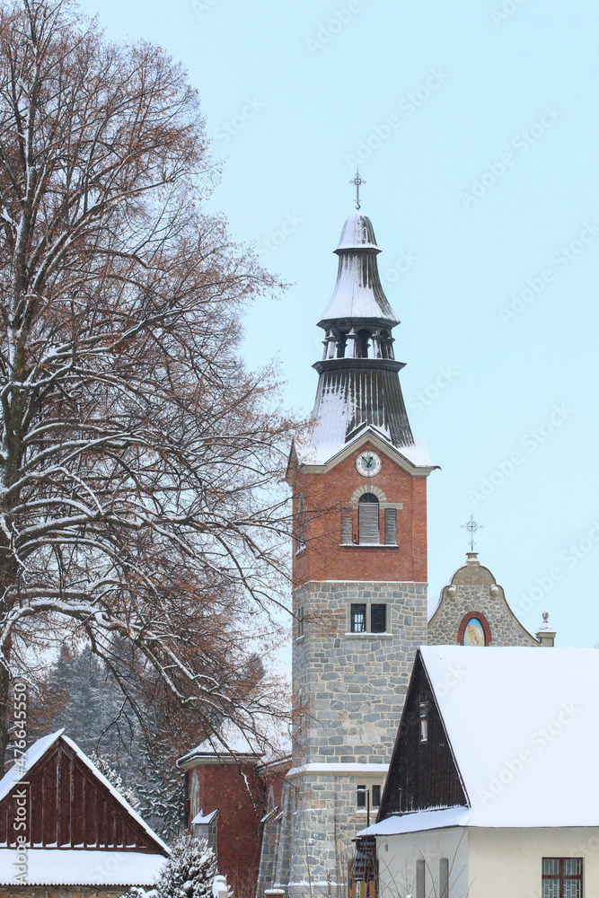 BIALKA TATRZANSKA, POLAND - DECEMBER 21, 2021: Church of Saint Simon and Jude the Apostle in Bialka Tatrzanska, Poland.