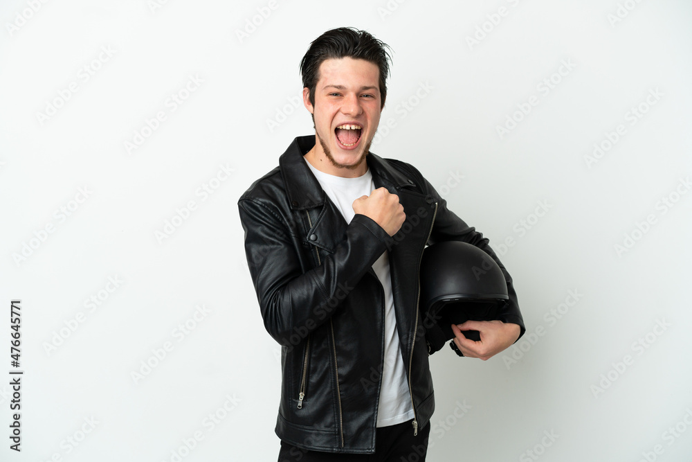 Russian man with a motorcycle helmet isolated on white background celebrating a victory Russian man with a motorcycle helmet isolated on white background celebrating a victory