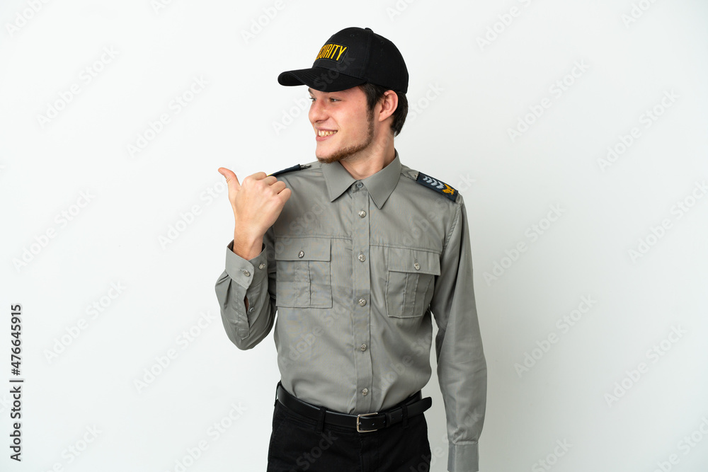Young Russian security man isolated on white background pointing to the side to present a product Young Russian security man isolated on white background pointing to the side to present a product