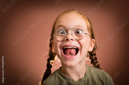 Excited Young Girl with Thick Eyeglasses, Making a Funny Face