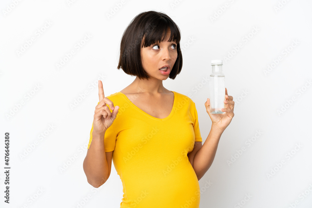 Young pregnant woman holding a bottle of water isolated on white background thinking an idea pointing the finger up Young pregnant woman holding a bottle of water isolated on white background thinking an idea pointing the finger up