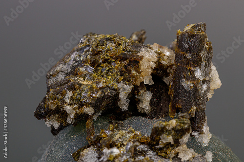macro mineral stone Prehnite on Epidote on a gray background
