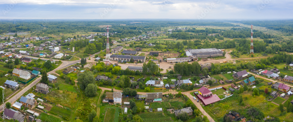 Aerial view from a drone of a rural village in the Kirov region, private houses and vegetable gardens in the village of Arbazh