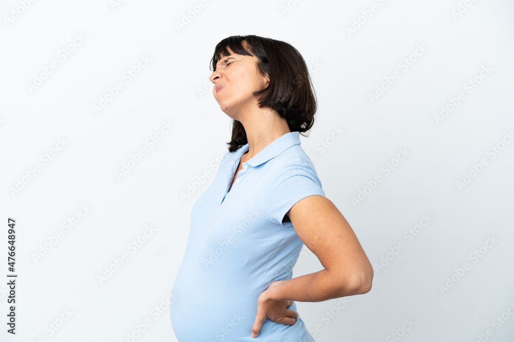 Pregnant woman over isolated white background suffering from backache for having made an effort Pregnant woman over isolated white background suffering from backache for having made an effort