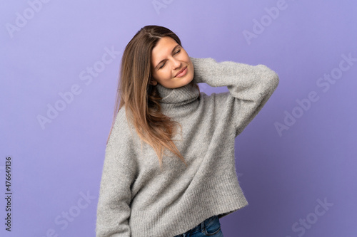Young Slovak woman isolated on purple background with neckache © luismolinero