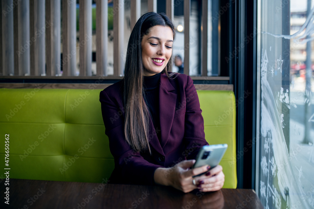 Young modern businesswoman using smartphone Young modern businesswoman using smartphone