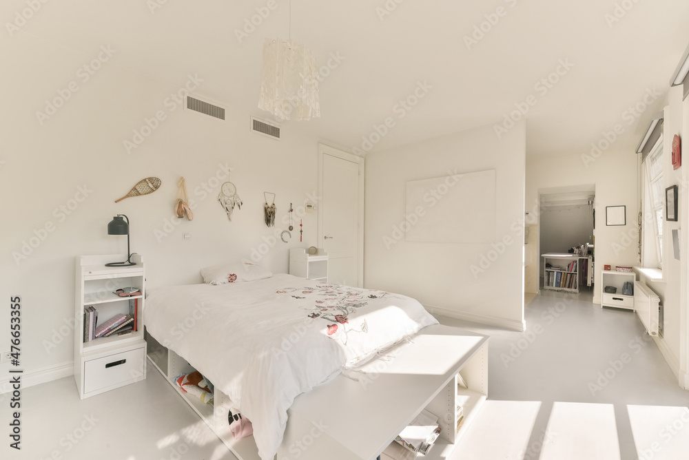 Teen bedroom interior with white furniture and walls with decorations ...