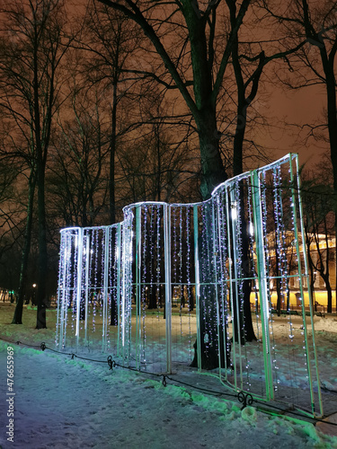 Festive illumination for Christmas and New Year in the Alexander Garden of St. Petersburg