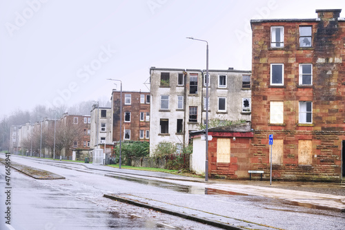Derelict council house in poor housing estate slum with many social welfare issues in Port Glasgow photo