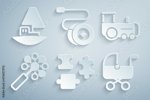Set Puzzle pieces toy, Toy train, Rattle baby, Baby stroller, Yoyo and boat icon. Vector