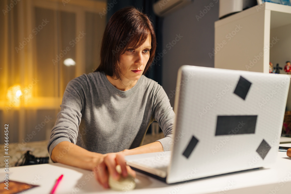 Woman using laptop shopping online buying clothes browsing online store e-commerce on mobile technology
