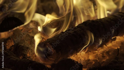 Fire burning wood logs with yellow and orange flames. HDR BT2020 HLG