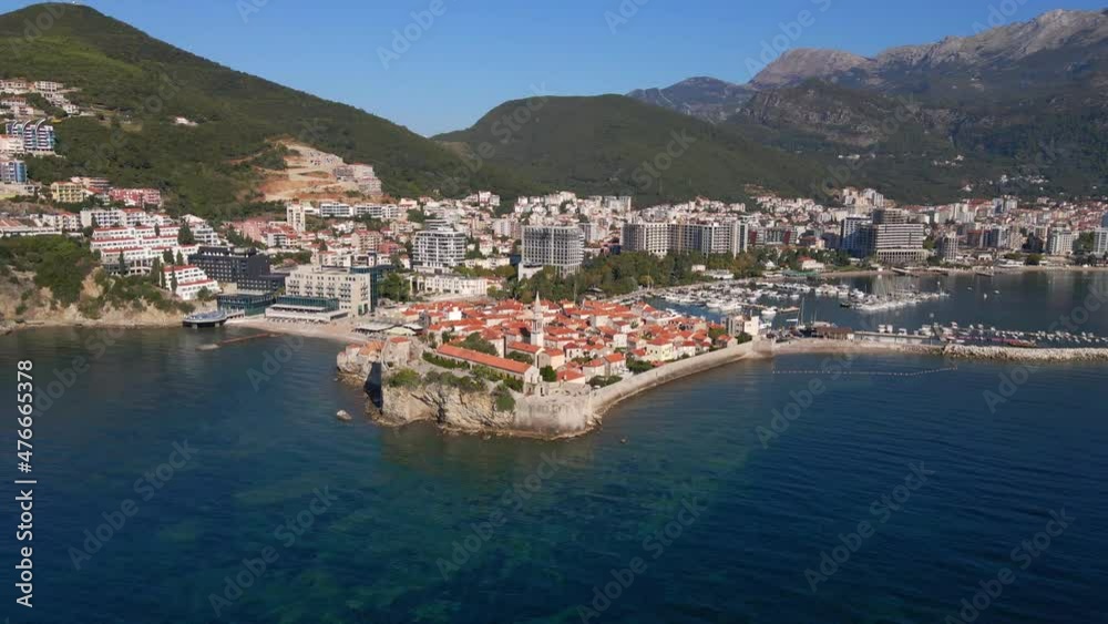 Aerial video. Slowmotion shot. The Old Town of the city of Budva popular tourist destination in Montenegro Aerial video. Slowmotion shot. The Old Town of the city of Budva popular tourist destination in Montenegro