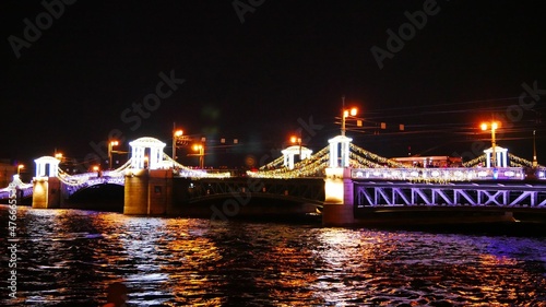 illumination and decoration of the bridge on a festive night