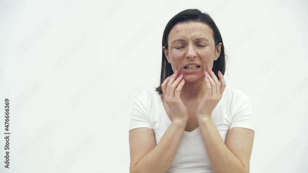 4k video of woman touching her damaged skin. 4k video of woman touching her damaged skin.