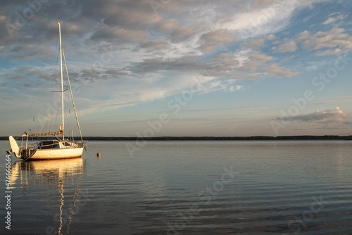 Small pleasure yacht on an evening summer evening