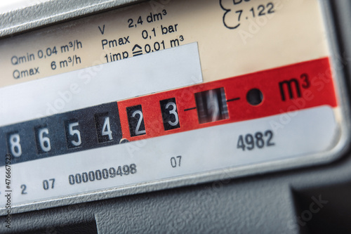 Close up of gas meter with rotating digit.