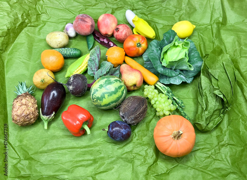A mix of mini vegetables and fruits on an isolated background