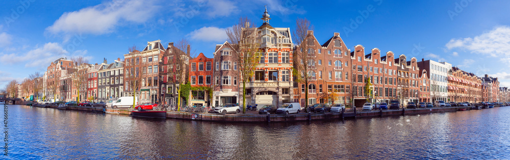 Panorama of the city embankment of Amsterdam on a sunny day.