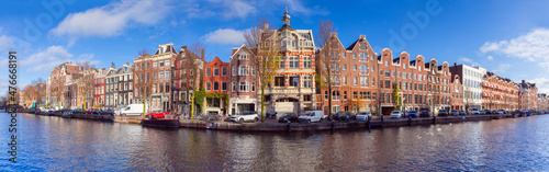 Panorama of the city embankment of Amsterdam on a sunny day.