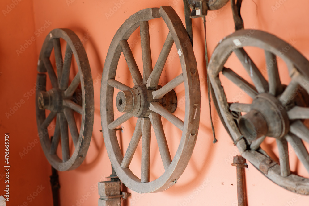 Old wooden wheels of coach ready for repair