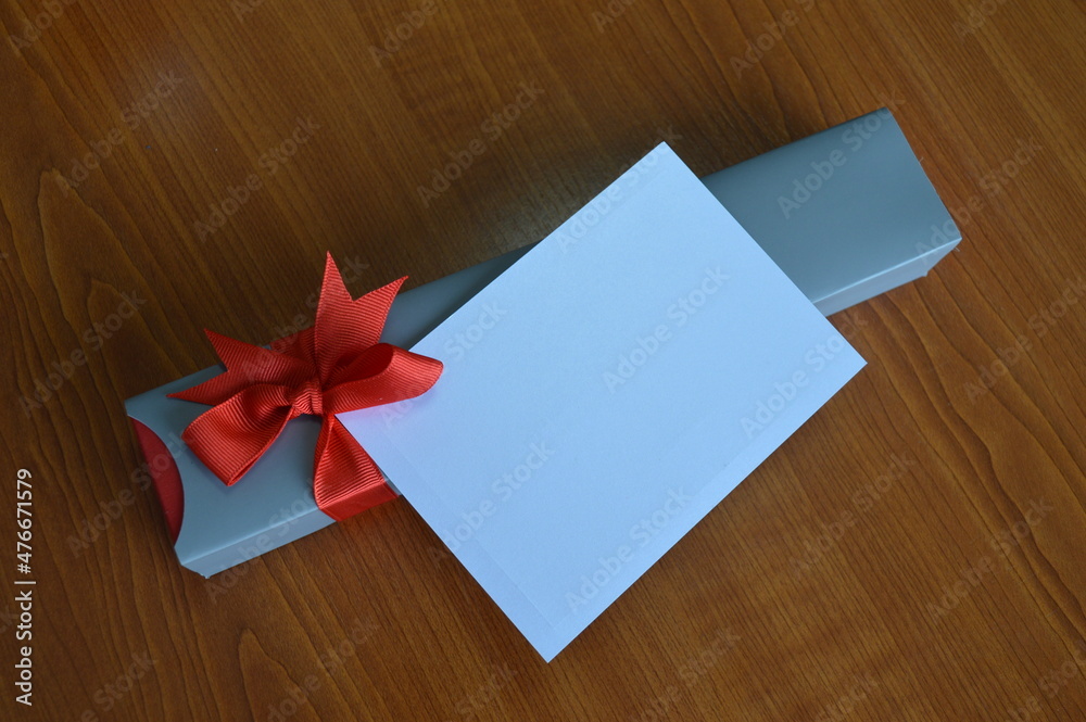gray gift box with red bow gray gift box with red bow