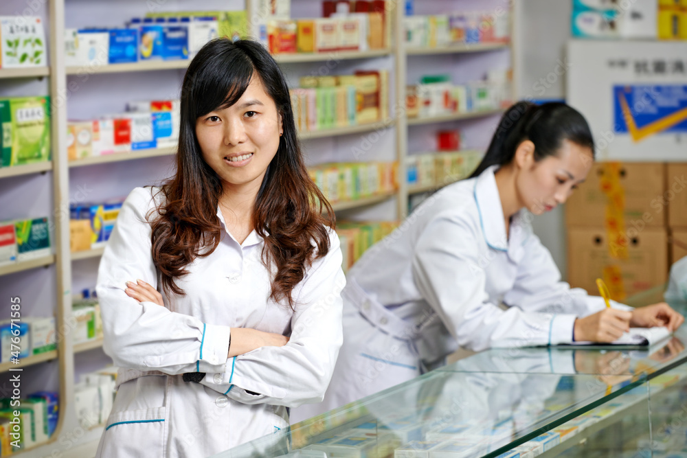 Chinese pharmacy worker in china drugstore