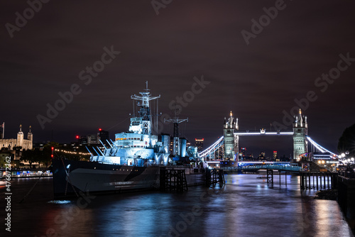 Iconic Tower Bridge view connecting London with Southwark over Thames River, UK. Beautiful view of the illuminated bridge at night.