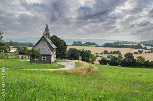 Scenic rustic school house in the rural landscape of Germany