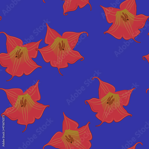 Seamless floral pattern with flowers of red datura. Brugmansia sanguinea. On blue background.