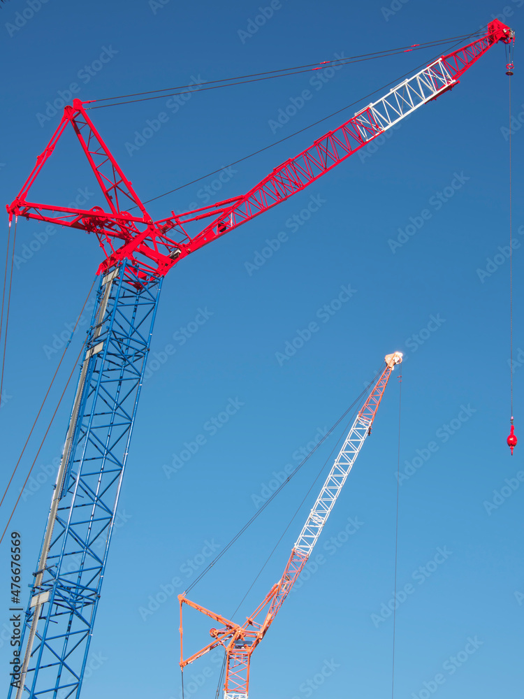 Tokyo,Japan - December 15, 2021: Crawler Crane or Luffing Jib Crawler Crane on blue sky background
Tokyo,Japan - December 15, 2021: Crawler Crane or Luffing Jib Crawler Crane on blue sky background