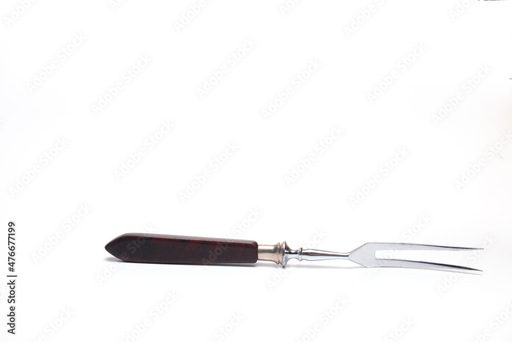 Fototapeta premium Closeup meat fork wooden handle white background