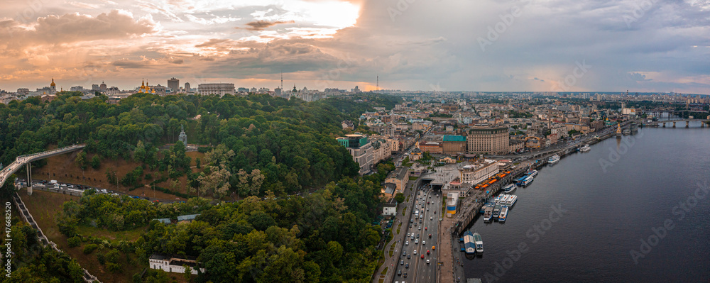 Panoramic view of Kyiv from the sky. Sunset over summer Kiev with Arch of Friendship of Peoples. Aerial view
