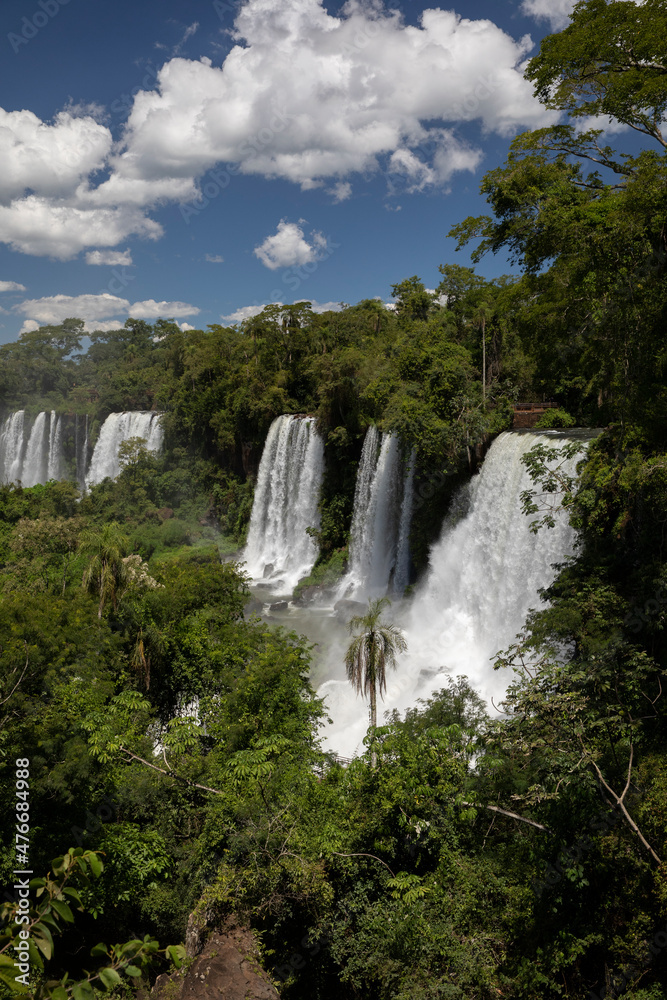 Obraz premium The waterfalls in the jungle. View of the white falling water flowing across the tropical rainforest.