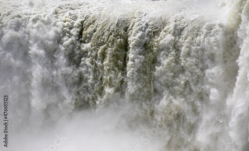 Natural background. Power in water. Closeup view of the the mist and falling white water. Beautiful texture, motion and pattern.