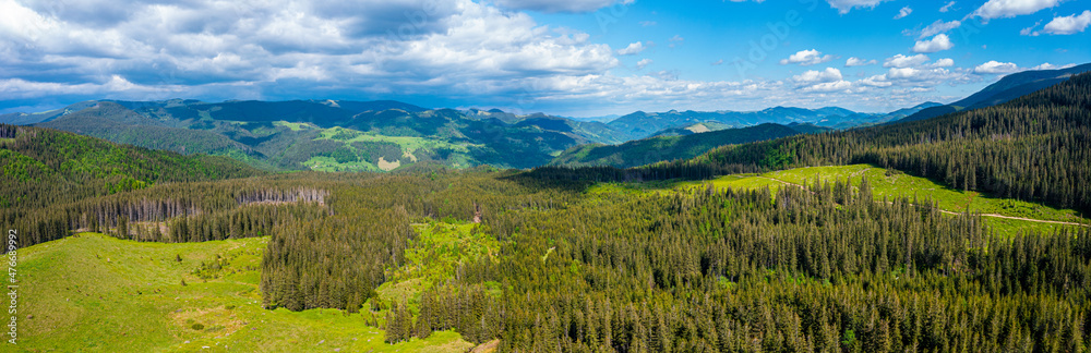 Panorama of beautiful countryside of Switzerland. Sunny afternoon. wonderful springtime landscape in mountains. Grassy field and rolling hills. rural scenery