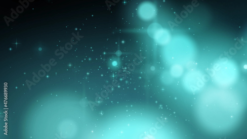 blurred blue particles on black background. twinkling blue lights