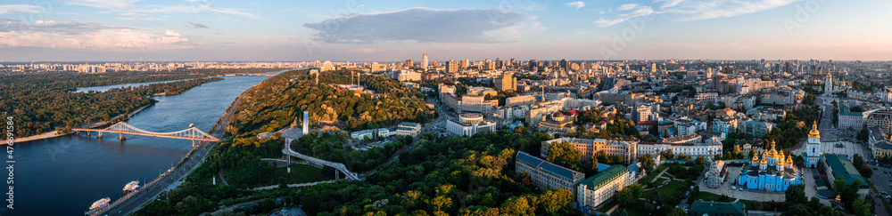 Panoramic view of Kyiv from the sky. Sunset over summer Kiev with Arch of Friendship of Peoples. Aerial view - obrazy, fototapety, plakaty 