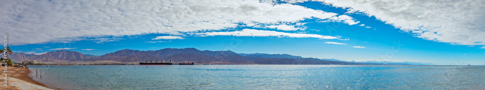Panoramic view on the Red Sea from a beach near Eilat - famous tourist resort and recreational city in Israel