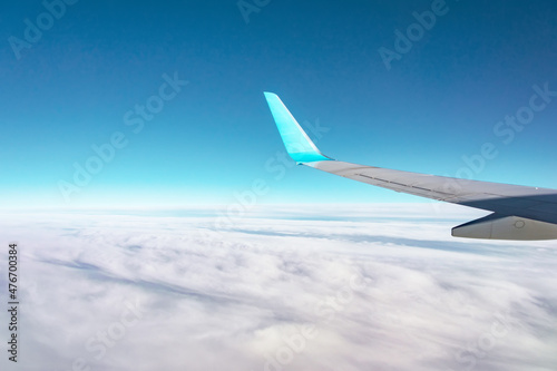 Wings of large passenger aircraft, flying at high altitude.
