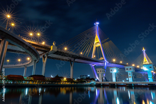 Bhumibol suspension bridge cross over Chao Phraya River in Bangkok, thailand at evening. Is one of the most beautiful bridges in Thailand. Selective focus.