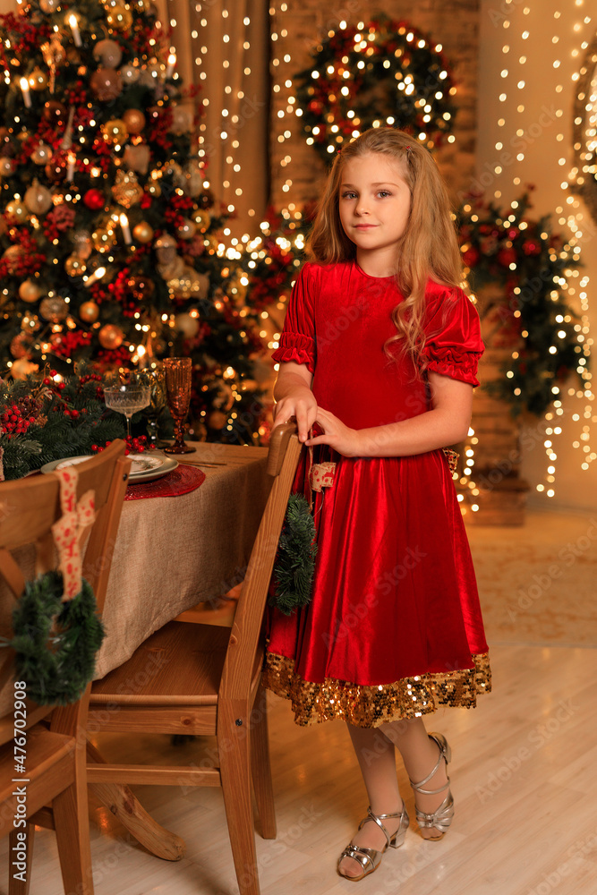 Happy New Year! beautiful girl near the Christmas table Happy New Year! beautiful girl near the Christmas table