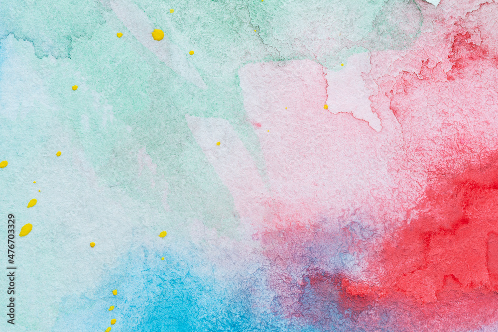 Macro close-up of an abstract colorful watercolor gradient fill background with watercolour stains and drops. High resolution full frame textured white paper background.