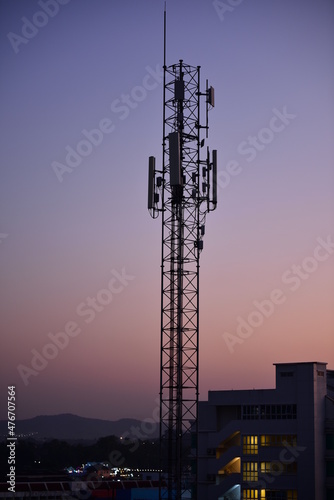 Silhouette Cellular communications Tower or 4G 5G of Network telephone with dusk sky in beautiful sunset