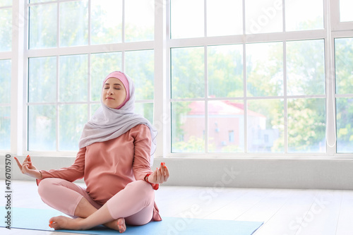 Young pregnant Muslim woman...