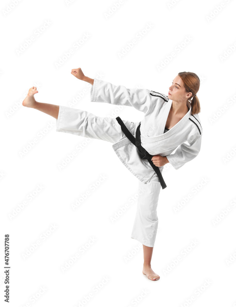 Young woman practicing karate on white background Young woman practicing karate on white background