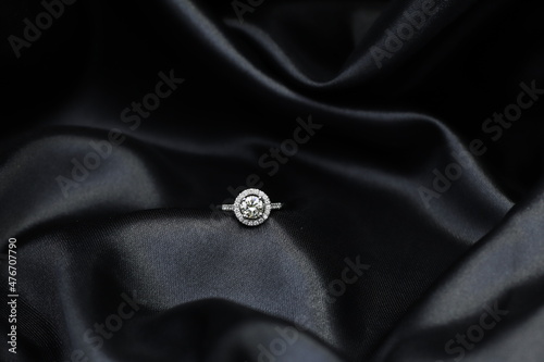 High jewelry banner with color natural gemstone and diamonds on gold ring setting. Black satin background for jewelry shop
