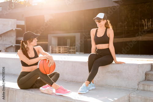 Sporty young women with bal...
