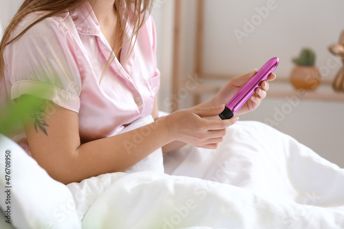 Young woman with vibrator i...